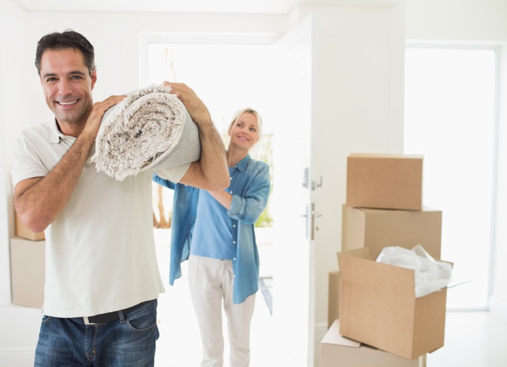 people moving a rug