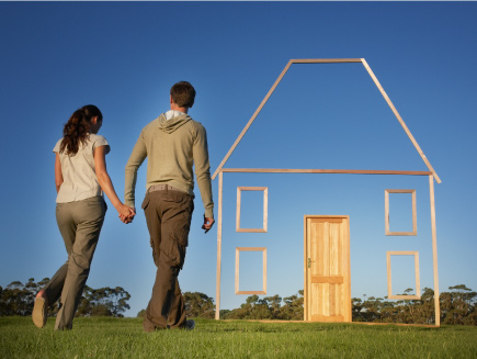 couple walking into stick image of house